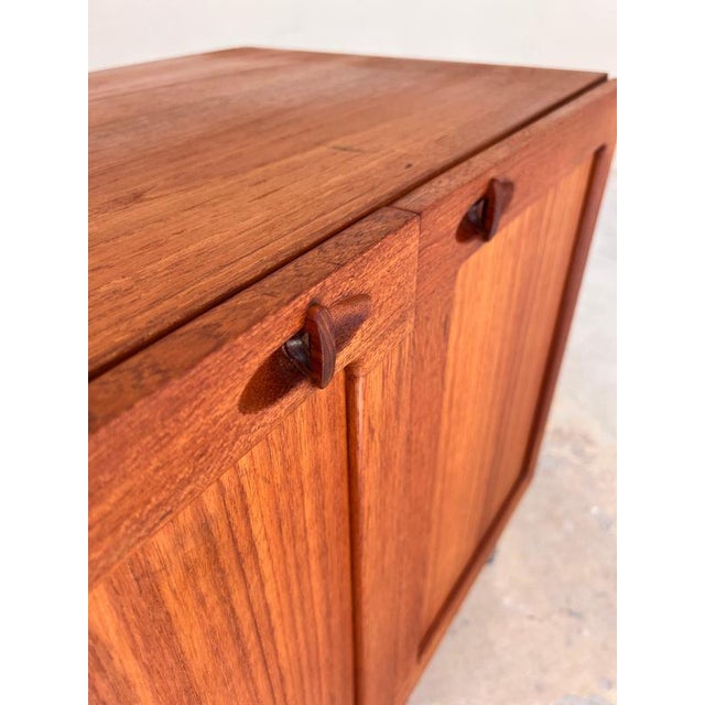 This teak chest of drawers is an absolutely exquisite design by the renowned designer H. W. Klein and a prime example of...