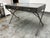 Design Plus Gallery presents the Flint Campaign Desk from Arteriors. The desk has an antique gray metal finish alluding to...