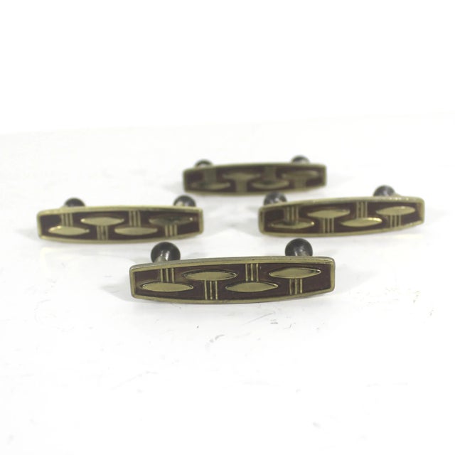 Set of four gold metal (probably brass) atomic mid century modern drawer pulls or handles with screws. These have...