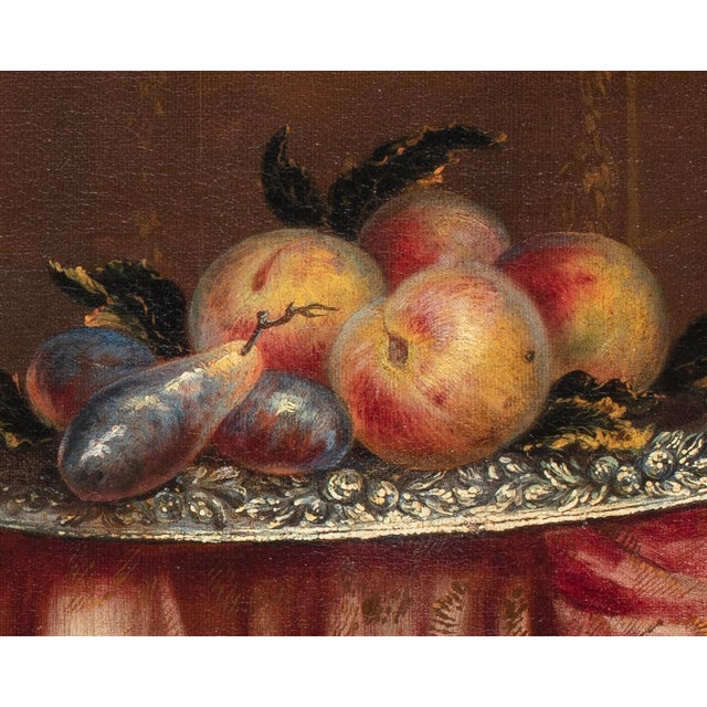 17th-century Roman Maestro Title: Still life with crockery, fruit and flowers on a cloth spread over a table Medium: Oil...