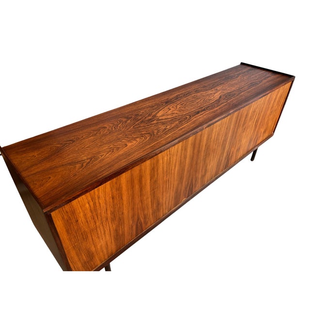 Extremely Rare! This exquisite Danish Modern sideboard by renowned designer Ib Kofod-Larsen showcases the elegance of mid-...