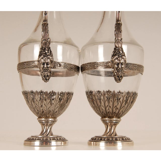 A pair of antique sterling silver and glass decanters Style: Louis XVI, Neoclassical, Victorian, French, 19th century,...