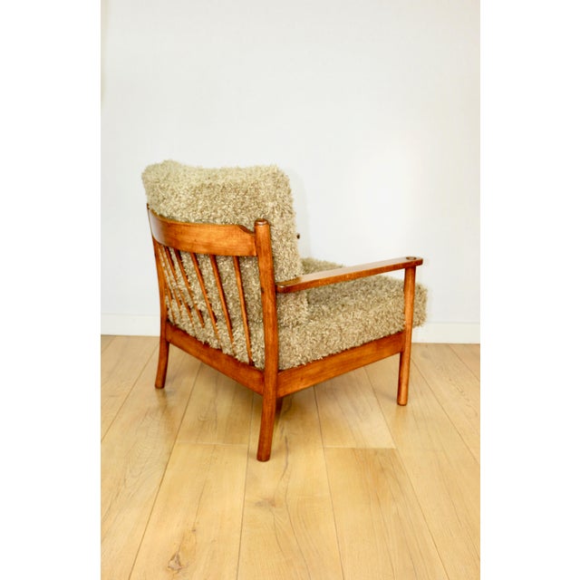 Wooden vintage brown armchair with olive green long pile fabric on removable cushions. A very comfortable and spacious...