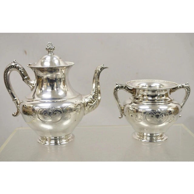 Antique Manhattan Silver Plate Co Silver Plated Tea Serving Set - 4pc Set. Listing includes (1) tea pot, (1) covered sugar...