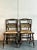 This charming set of four vintage Hitchcock chairs embodies a delightful blend of Americana folk art and rustic elegance....