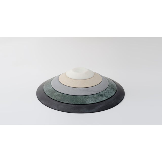 A collection of fine marble serving plates and trays, crafted entirely by hand by master craftsmen and stonemasons,...