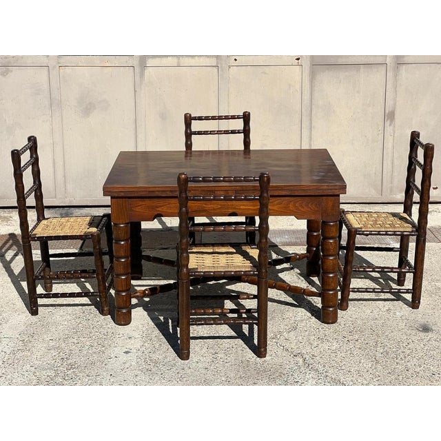 Extendable dining table (two 55 cm leaves) by Charles Dudouyt, solid wood, circa 1940, with spool legs. Very good...