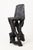 This sculptural chair is a singular expression of raw craftsmanship, carved by hand from a solid hardwood log and...