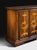 Handcrafted in Italy, this sideboard features richly figured walnut veneers accented with decorative marquetry inlays. The...