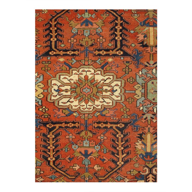 Antique Heriz Serapi Rug, Country of Origin: Persia, — The brilliant red field bears a central Ray of Life and many highly...