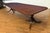 This is a Traditional Multi-Banded Mahogany Dining Table by Leighton Hall Furniture. It features a field of swirly crotch...