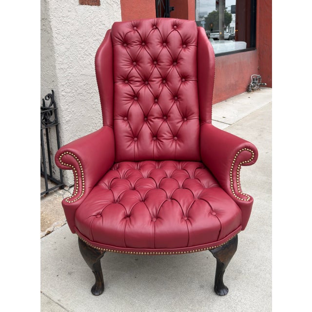 Antique Queen Anne Red Tufted Leather Wingback Chair & Ottoman Ottoman measures 28.75”W x 25”D x 16”H