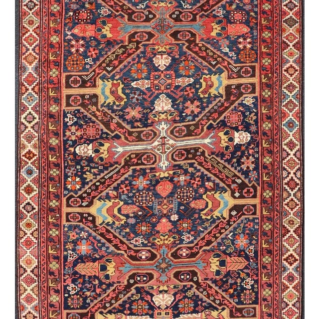 Measures: 5'10 x 12'10 Seychour rugs are known for their heavily tribal designs. This fine piece in particular holds...