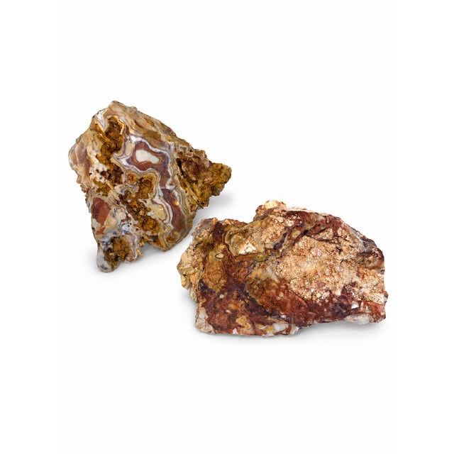An exceptionally tactile, curated pair of large-scale natural mineral specimens, exhibiting a commanding sculptural...
