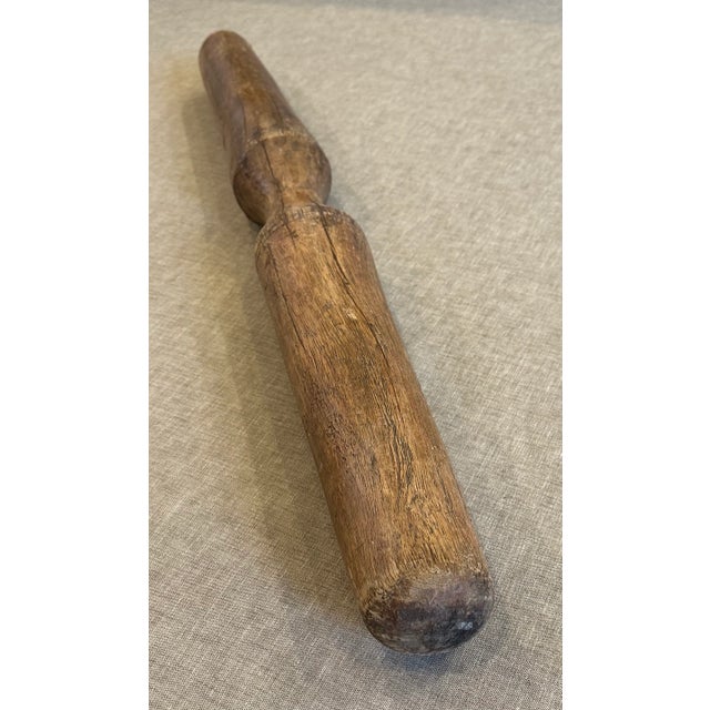 Wooden rustic Indian pestle. This vintage pestle shows that it was actually used for it's purpose. It has cracks and marks...