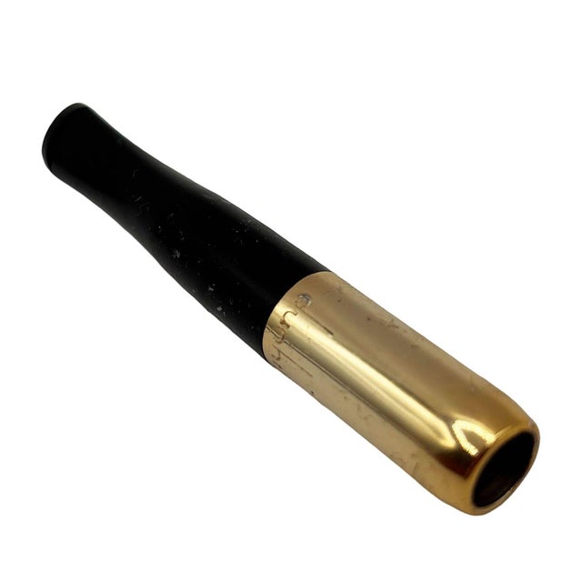 Crafted with the timeless elegance of the 1950s, this Vintage Dunhill Denicotea cigarette/cheroot holder is a classic...