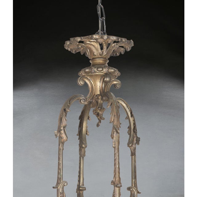 A large and impressive late c19th rococo revival bronze 12 light chandelier, with 4 main acanthus scrolling branches, each...