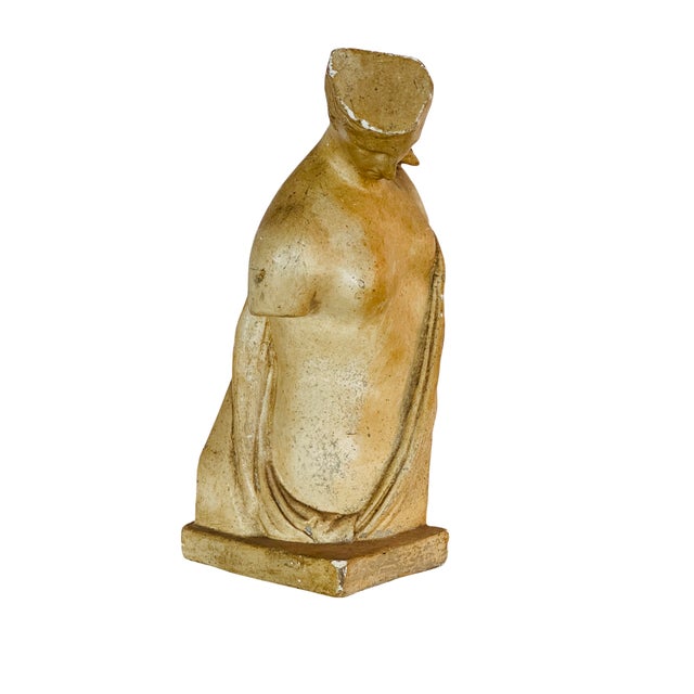 A classic plaster torso inspired by antique sculpture. Finished in soft, warm stone tones with a naturally aged look, this...