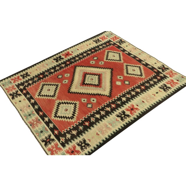 Handwoven in wool, this 8x9 vintage tribal kilim rug remarks a prestigious addition in our flatweave collection. This rare...