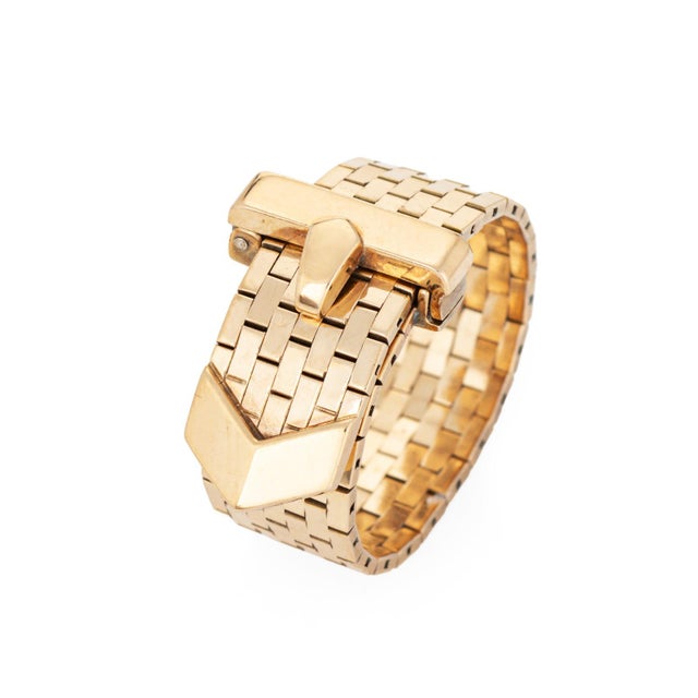 Stylish retro buckle ring crafted in 14 karat yellow gold (circa 1940s). The ingenuity of the ring lies in its design. The...