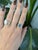 A 3.47-carat cambodian blue zircon oval sits at the centre of this solid 14K rose gold ring, framed by sixteen earth-mined...