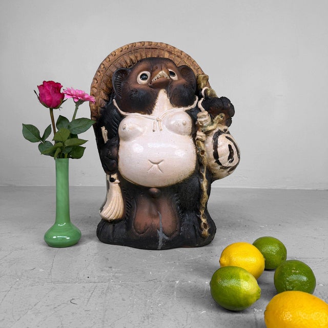 Characterful Tanuki figure in Shigaraki earthenware, dating from ca. 1970s–1980s, Shōwa period, Japan. This substantial...