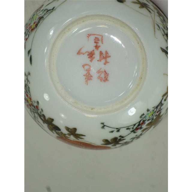 This is an antique Japanese Satsuma pitcher dating back to the 1800s. It features a multi-color red design with bird and...