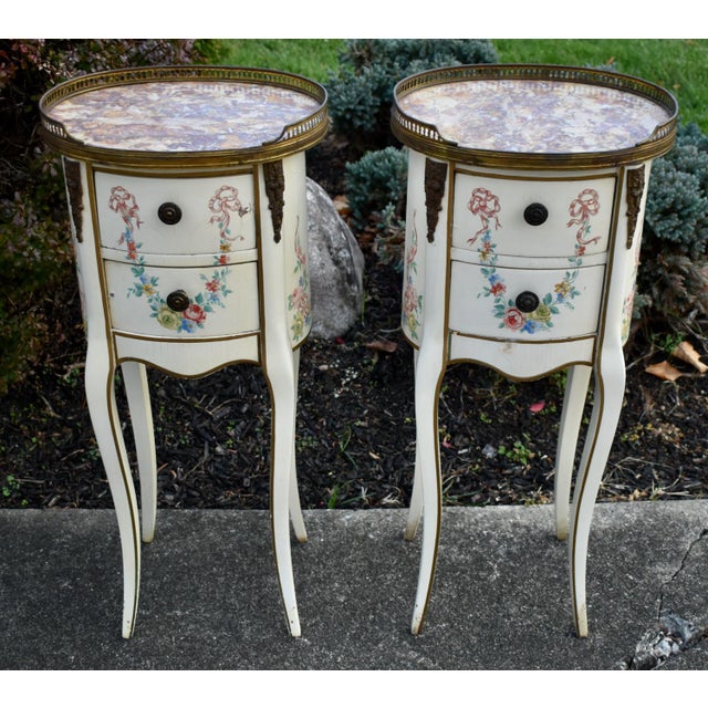 Antique (1890's) Pair of Tables have a French Style. Made of Wood, Marble, Brass, and Bronze. Features: Two Drawers,...