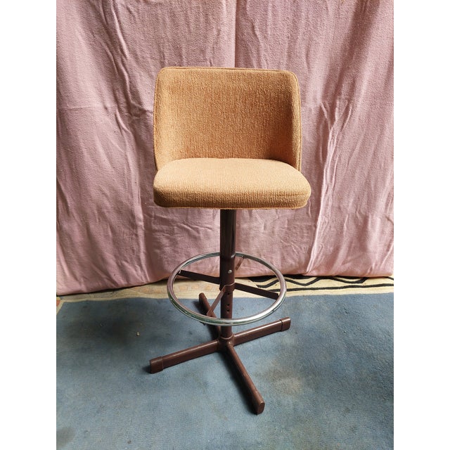 This pair of peach colored counter stools packs a punch of personality. Simple and comfortable, they were manufactured in...