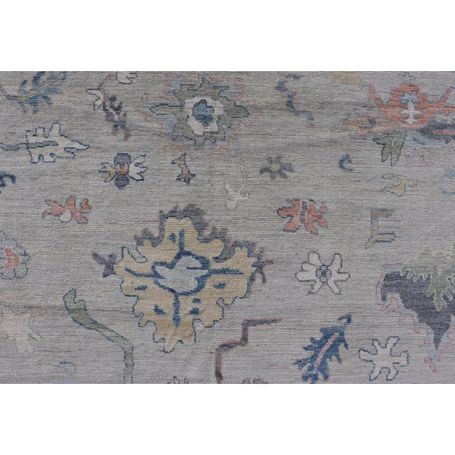Modern Oushak Rug With Slate Blue Border and Colorful All-Over Tribal Motifs For Sale - Image 11 of 15
