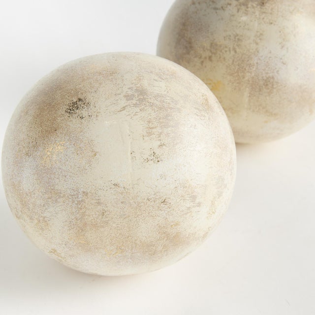 Hand painted, and handappliedGold leafing makes these decorative orbs special. Made out of iron, these substantial orbs...