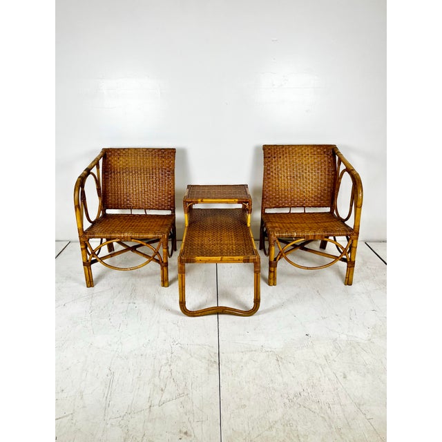 Vintage mid century rattan sectional side table and arm chairs set. Woven caning wrapped chairs with bent rattan details....
