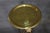 A striking and substantial pair of Regency-style brass pedestals or plant stands, distinguished by their elegant...