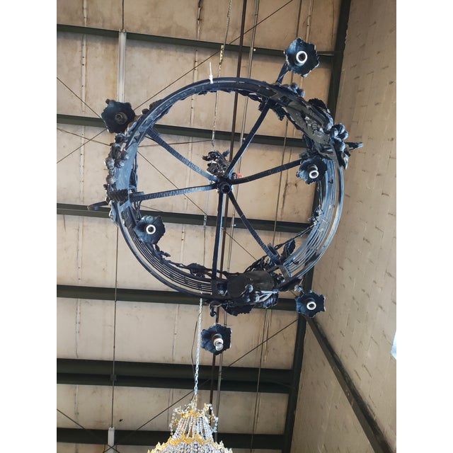 Exceptional 19th-century French forged iron chandelier, originally from the music hall of a Provençal castle. Hand-forged...