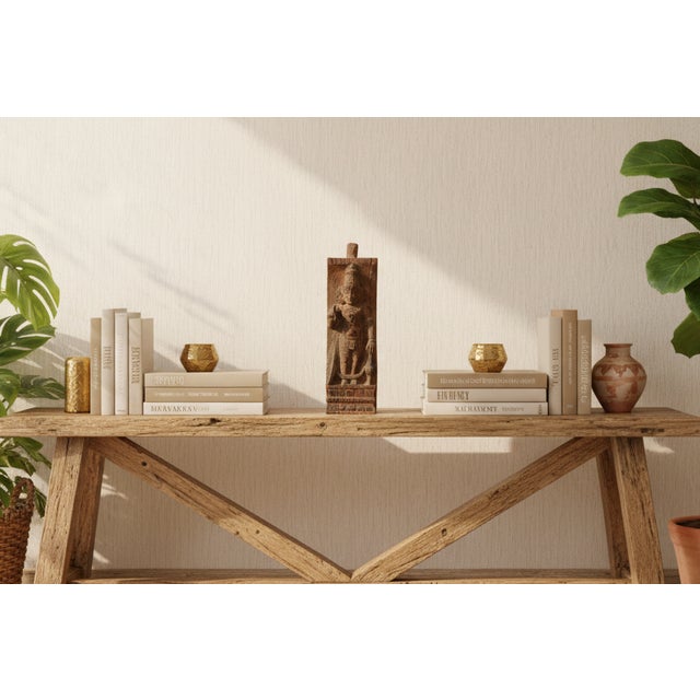 A structural fragment with spiritual significance, this solid wood panel was originally part of a South Indian temple...