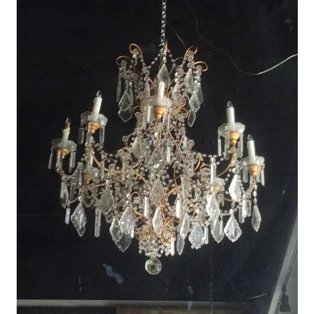 Large early 20th century Italian gilt metal and crystal chandelier with macaroni beaded decorations. This would look great...