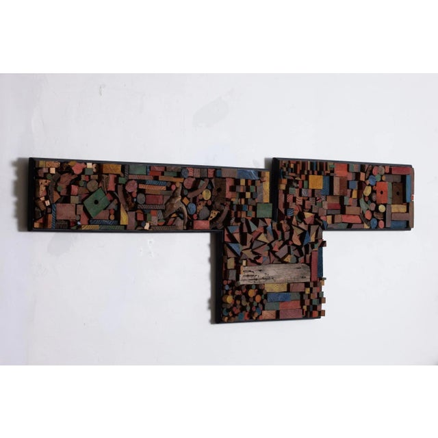 Mosaic wood assemblage in the style of Mabel Hutchinson. This large scale wall piece features a mix of earth tone and...