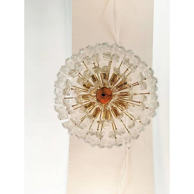Breathtakingly beautiful chandelier by J. T. Kalmar, Austria, from the 1970s. Brass frame, gold-plated with 42 heavy...
