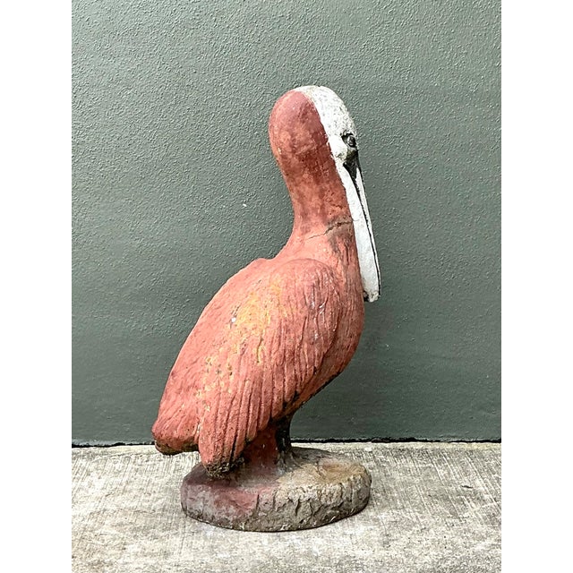 This vintage painted cement pelican sculpture brings a bold coastal note to a garden, patio, poolside setting, or sunroom....