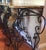 This beautiful exquisite wrought iron console table with with elaborate scroll curl design has green onyx marble top . The...