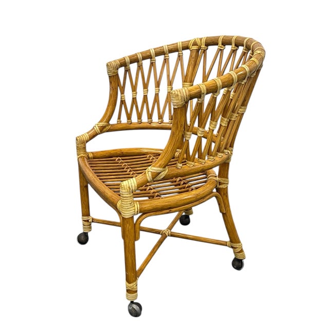 An exceptional set of four vintage McGuire rattan barrel chairs, showcasing the brand’s iconic craftsmanship, sculptural...