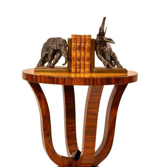 A refined Art Deco style side table for today’s interiors, with the warm swirl of burl walnut and the crisp contrast of a...
