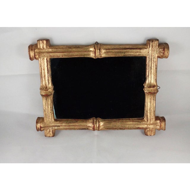 Vintage Florentine, hand gilded mirror, faux bamboo style that was made in Italy, circa 1960s. Gilded frame and mirror are...