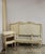 A matching pair of vintage Drexel French Country / Provincial twin beds in a soft off-white painted finish with subtle...