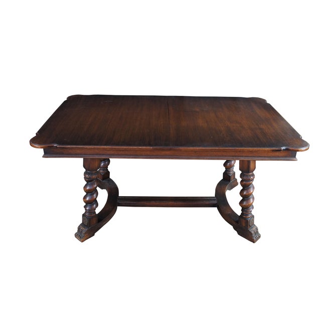 Early 20th century Jacobean inspired dining table. Made from oak with a rectangular top with rounded corners. Over four...