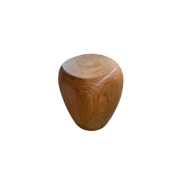 This solid teak wood stool is a masterpiece of craftsmanship, showcasing stunning natural wood textures and a beautifully...