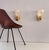 Beautiful set of two gorgeous brass wall lamps made of strong brass base and light amber colored murano glasses with real...