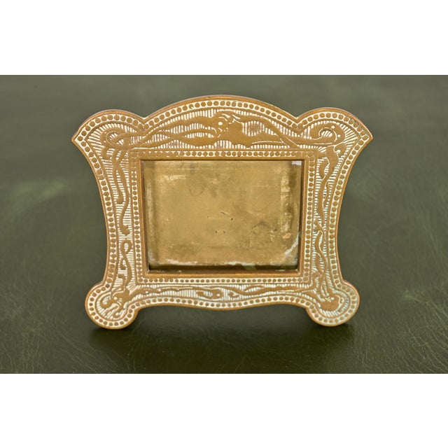 A gorgeous Art Deco or Arts & Crafts period "Viking" collection bronze picture frame or perpetual calendar frame In the...