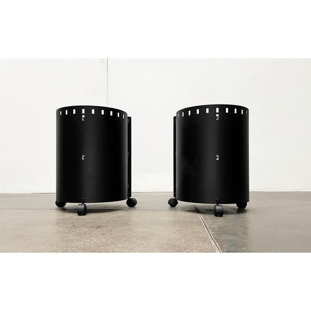 Postmodern metal side tables or home bars from D-Tec from the 80s. The round body is made of heavy steel and is powder-...