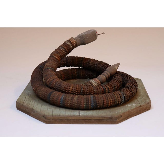 Vintage Folk Art Hand-Carved Wood and Bottlecap Snake on Octagonal Base For Sale - Image 4 of 12